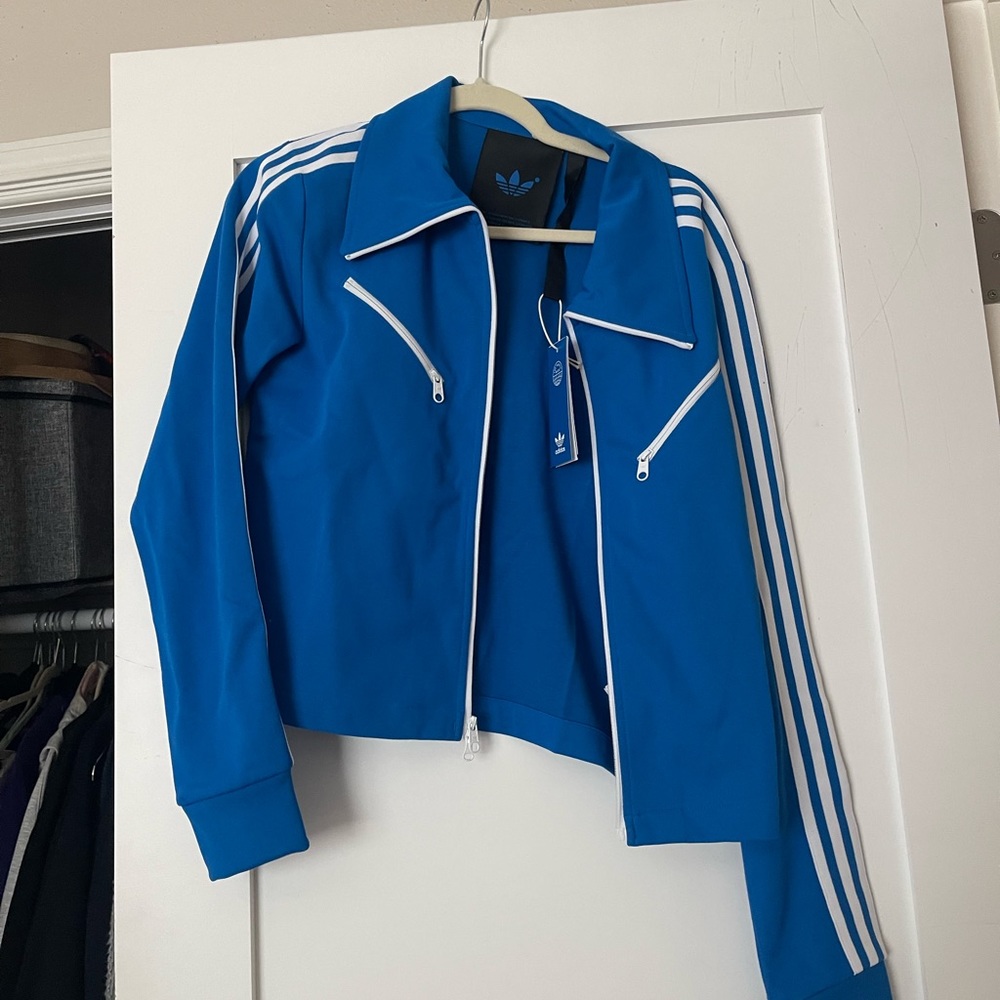 Brand new blue women’s adidas jacket never worn
